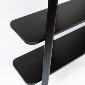 Top-down close-up of the black Wenge shelves, showing the rounded corners and smooth satin finish.