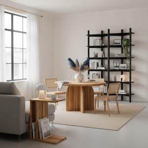 An inspiration image showing the black Wenge bookshelf and oak dining table from the same Dabov Studio collection.