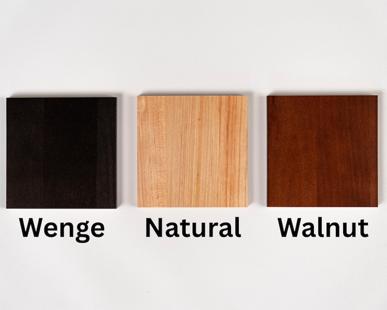 A photo of the three available wood finish swatches: Wenge (dark black-brown), Natural (light alder), and Walnut (mid-tone brown).