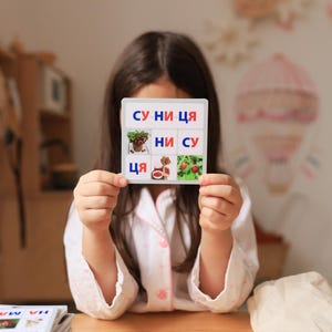 Juego educativo de lotería basado en sílabas en ucraniano. Aprenda letras, palabras y sílabas para niños en edad preescolar y de primer grado. Alfabeto ucraniano.