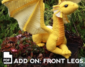 May include: A crochet pattern for a yellow dragon with wings, labelled "ADD ON: FRONT LEGS". The pattern is available as a PDF download.