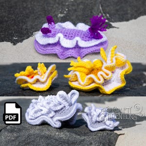 Peut inclure: Plusieurs créations de limaces de mer au crochet faites à la main, dans des tons de violet, jaune, blanc et gris. L'image comprend une icône PDF et le logo Crafty Intentions.