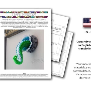 May include: A crochet pattern for a tentacle in a porthole is shown, with a difficulty scale. The finished tentacle is green, blue, and white. The pattern is written in U.S. terminology. The image also includes the American flag and the text "EN - English".