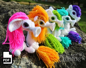 Schema digitale in PDF per realizzare un amigurumi all'uncinetto a forma di mocio oscillante, creato da Crafty Intentions.