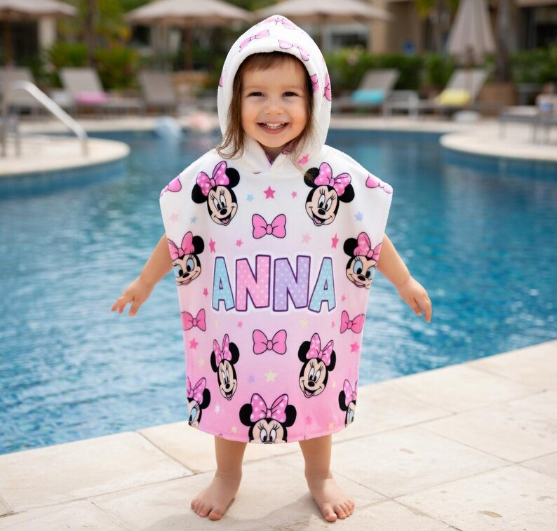 May include: A white ceramic mug with a black handle and the text "But First, Coffee" in a bold, black font. The mug is set against a blurred background, highlighting its clean design.