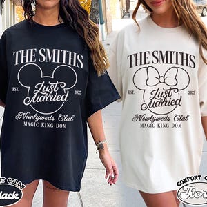 May include: Black and ivory Comfort Color t-shirts with the text "THE SMITHS" and "Just Married" in a Mickey Mouse-inspired design. The shirts also include "Newlyweds Club" and "MAGIC KING DOM" text, with the year "2025".