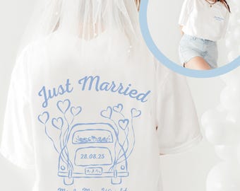 May include: White t-shirt with a light blue graphic that says "Just Married" with a car and hearts design. The date "28.08.25" is printed on the car. The text "Mr. & Mrs. Wright Always and Forever" is also printed on the shirt.