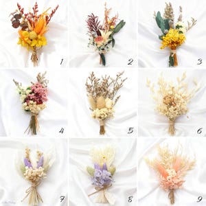 May include: Nine small dried flower bouquets, each tied with twine. The bouquets feature a variety of colors, including yellow, orange, red, pink, and purple. Some bouquets have a mix of textures and shapes, with feathery grasses and round blooms.