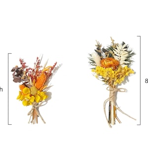 May include: Two dried flower bouquets. The first is 6.4 inches tall, featuring yellow, orange, and brown flowers tied with twine. The second bouquet is 8.1 inches tall, with yellow and orange flowers, and tied with twine.