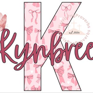 May include: A pink and white graphic design featuring the name "Kynbree" in a cursive font, with a large letter "K" filled with a pattern of pink bows. A watercolor butterfly is on the left. The design includes the text "Harris Proverbs est.2024".