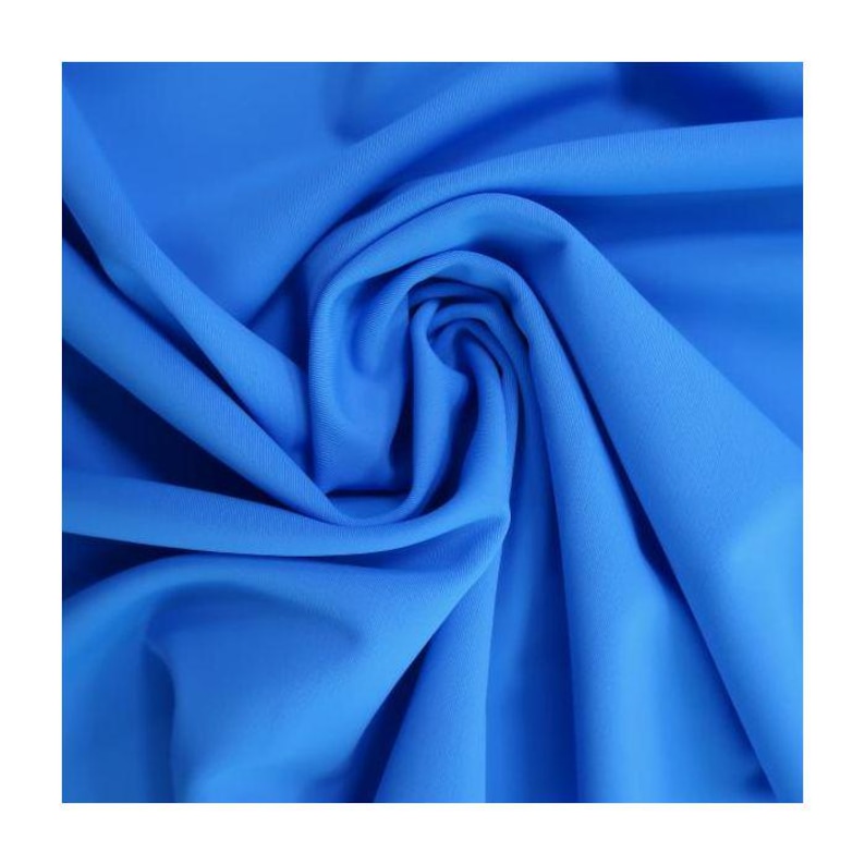 May include: A close-up of a bright blue fabric, showing its texture and drape.