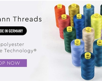 Puede incluir: Una variedad de carretes de hilos Gütermann de colores, hechos en Alemania, con el texto "100% poliéster Micro Core Technology" y "Comprar ahora".