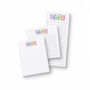 May include: Three white paper notepads of varying sizes, each featuring the text "LISA J. STEWART" and "PHYSICAL THERAPIST" in colorful, multi-toned lettering. The two larger pads include horizontal black lines for writing and circular bullet points.