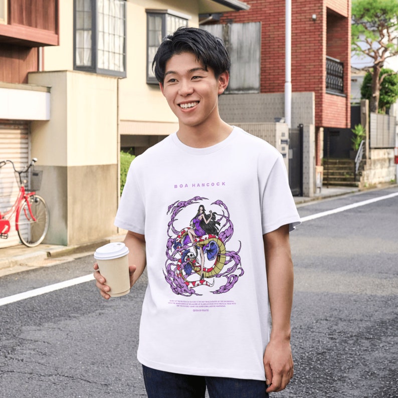 May include: White t-shirt with a purple and black graphic of Boa Hancock from the anime One Piece. The text "BOA HANCOCK" is printed in purple above the graphic. The shirt is being worn by a person.