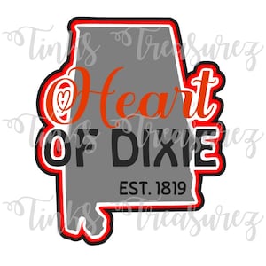 May include: A gray outline of the state of Alabama with a red border. The words "Heart of Dixie" are written in black with a white outline. The words "EST. 1819" are written in black below the state outline.