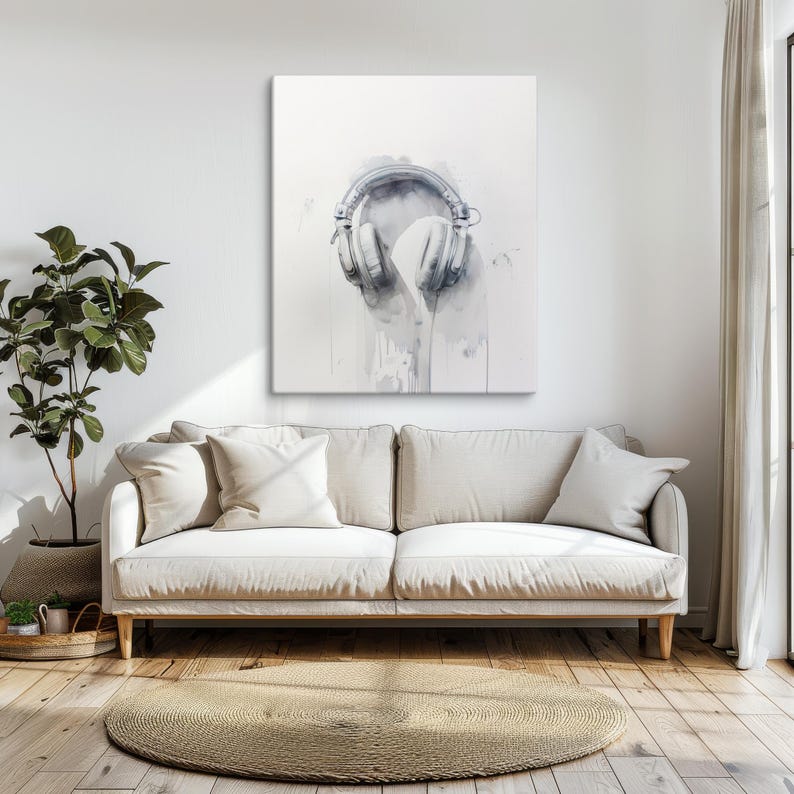 May include: A watercolor painting of a pair of silver headphones on a white background. The headphones are dripping with gray paint, creating a unique and abstract design.