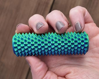Rodillo con púas de dragón, juguete antiestrés que cambia de color para mejorar la percepción sensorial