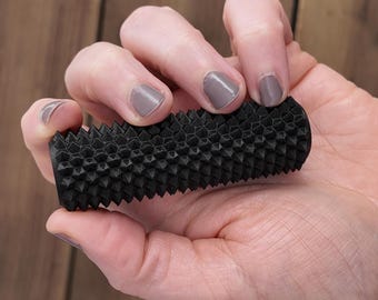 Classic Black Handheld Spiky Roller Fidget Toy With Hidden Storage