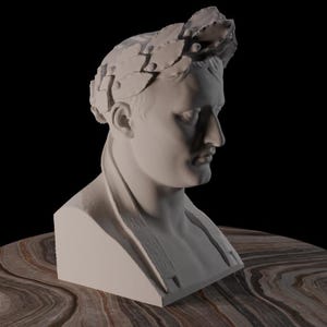 May include: A white bust of a man wearing a laurel wreath, set against a black background. The sculpture is on a round, brown and tan marbled surface. The bust is a classical art piece.