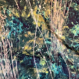 May include: A fabric featuring a dark, mottled background in shades of deep teal, forest green, and golden yellow. Overlaid on this textured surface are thin, pale, vertical lines and delicate, branching silhouettes resembling tall grasses.