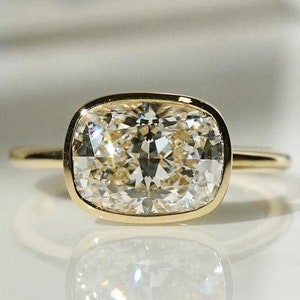East-West Cushion Cut Lab Grown Diamond Ring: Bezel Set Solitaire
