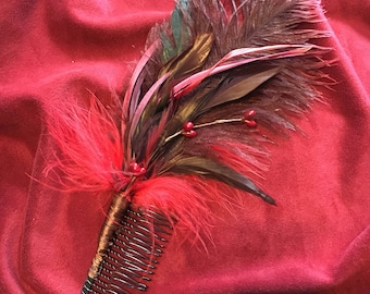 Feathered fascinator in reds
