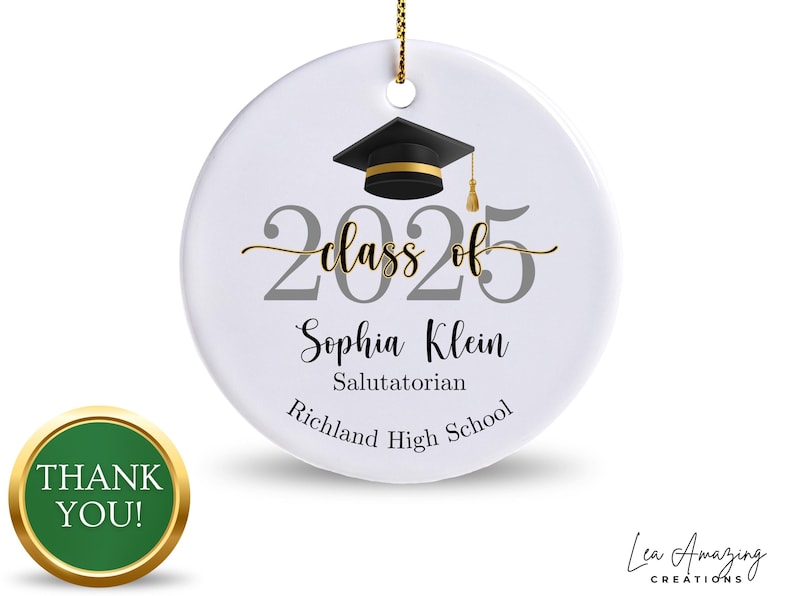 May include: White graduation ornament with a black mortarboard, gold tassel, and the text "Class of 2025." Includes the name "Sophia Klein," "Salutatorian," and "Richland High School." A gold cord is attached for hanging.