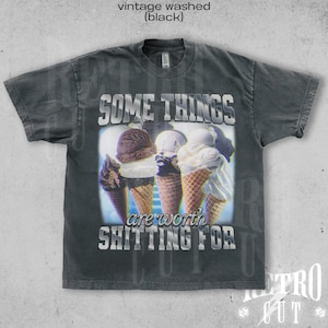 May include: A black vintage washed t-shirt with a graphic of ice cream cones and the text "Some things are worth shitting for".