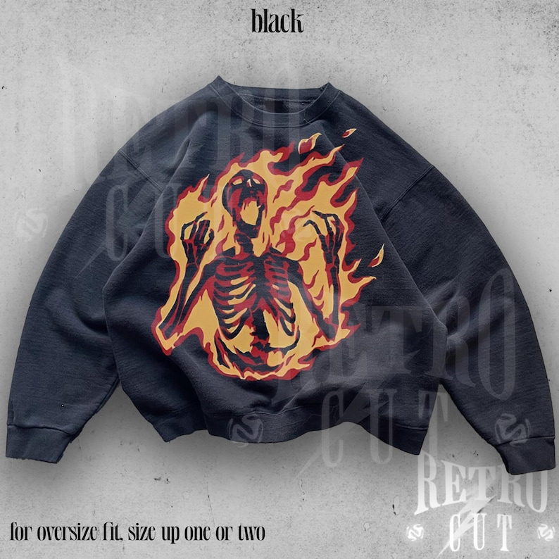 May include: Black sweatshirt with a graphic print of a skeleton engulfed in flames. The text "for oversize fit, size up one or two" is printed below the image.