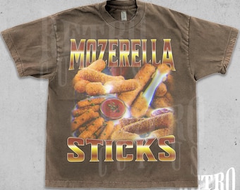 May include: A brown t-shirt with a vintage washed look features a graphic of mozzarella sticks with the text "MOZZERELLA STICKS" in a gold-colored font.