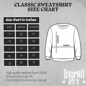 May include: Size chart for a classic sweatshirt in inches. The chart shows the width and length of the sweatshirt in inches for sizes S, M, L, XL, and 2X. The chart also includes a diagram of a sweatshirt with the width and length labeled.