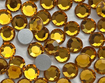 9 mm round vintage Swarovski crystal rhinestones in transparent golden yellow topaz. ss 42 flatbacks. Faceted round Art 2000. Choose 6 or 12