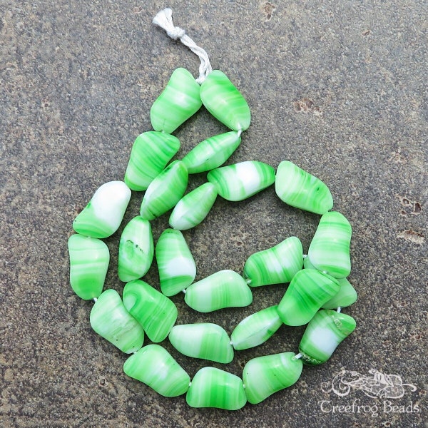 1960's vintage Czech glass beads in apple green and white swirl. Strand of 24 large glass twist beads for jewelry design and beading crafts.