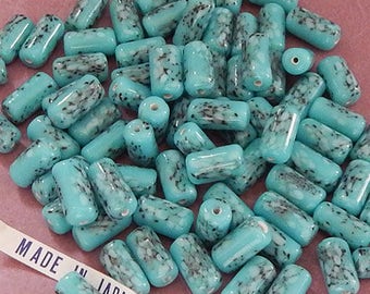 12 vintage Japanese porcelain tube beads in imitation turquoise. 14 mm cylinder beads in speckled robins egg blue for jewelry crafts.