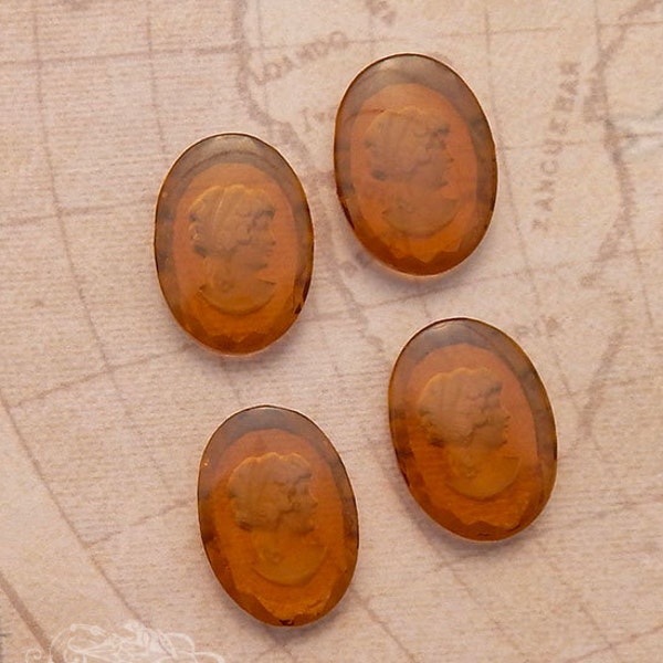 West German glass intaglio cameos in smoked topaz. 18x25 mm oval cabs w/ reverse carved woman's face in transparent brown amber. 4 pc.