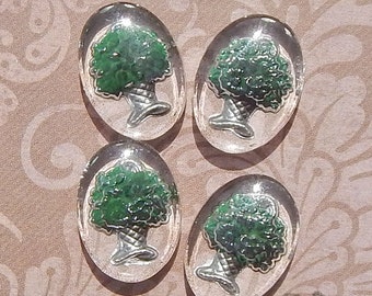 4 vintage glass intaglio cabochons with dark green flower basket motif. Small 13x18 mm reverse painted stones for jewelry design.