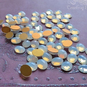 Small 8x10 mm FACETED glass cabochons in white opal. Lot of 6 sparkling vintage West German oval cabs for rings and earrings.