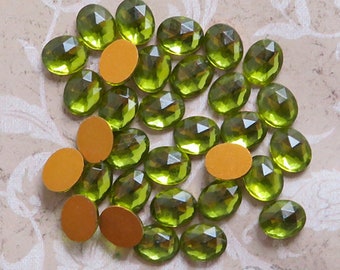 Small 8x10 mm FACETED glass cabochons in transparent olive green.  Lot of 6 vintage West German oval cabs for rings and earrings.