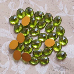 Small 8x10 mm FACETED glass cabochons in transparent olive green.  Lot of 6 vintage West German oval cabs for rings and earrings.