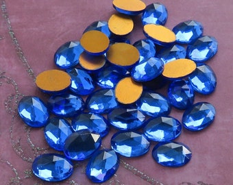 6 vintage 10x14 mm FACETED glass cabochons in sapphire blue. NOS West German oval stones for beadwork, wirework & costume jewelry repair.