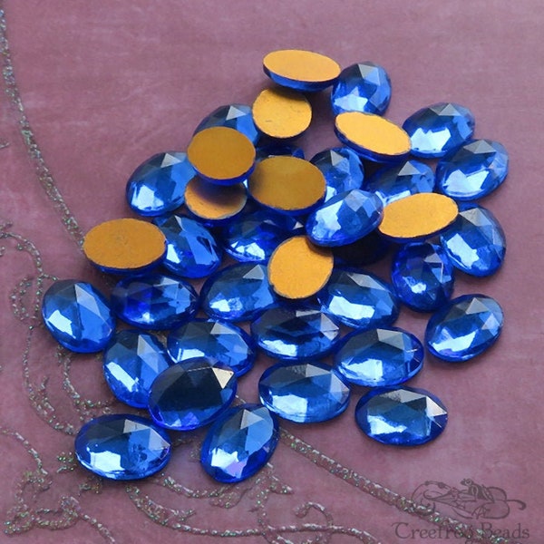 6 vintage 10x14 mm FACETED glass cabochons in sapphire blue. NOS West German oval stones for beadwork, wirework & costume jewelry repair.