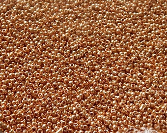 Size 14/0 or 15/0 glass seed beads. Late 1800's vintage microbeads in metallic golden bronze. Tiny beads for doll makers & purse repair.