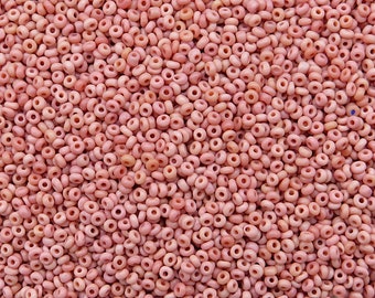Size 13/0 vintage seed beads in classic pale Cheyenne pink. 10 gr of old Czech glass beads in dusty rose pink with a hint of peach or salmon