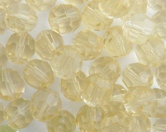 1930's vintage German glass beads. Larger 8mm faceted rounds in citrine yellow. Lot of 25 pale transparent yellow facet glass beads.
