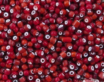 Size 6/0 red rose vintage Italian white heart seed beads. 10 grams of antique Venetian glass Hudson Bay or Cornaline D'Allepo beads.