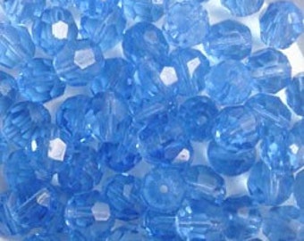 Large 8mm faceted round glass beads in transparent sapphire blue. 1930's vintage glass, made in Germany. 25 piece lot.