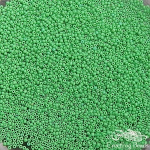 Size 20/0 antique micro seed beads in opaque green parrot. Late 1800&#39;s vintage tiny green glass microbeads for restoration or purse repair.