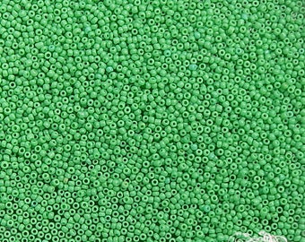 Size 20/0 antique micro seed beads in opaque green parrot. Late 1800's vintage tiny green glass microbeads for restoration or purse repair.