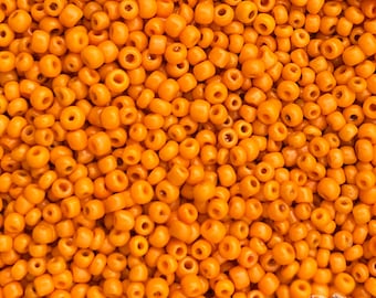 Size 11/0 vintage Venetian seed beads in opaque pale pumpkin orange. 10 grams of collectible hand made antique Italian glass rocailles.