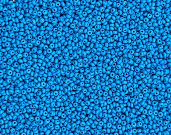 Size 14/0 antique Italian seed beads in opaque cerulean blue. 10 grams of tiny handmade vintage Venetian glass beads in dark turquoise blue.